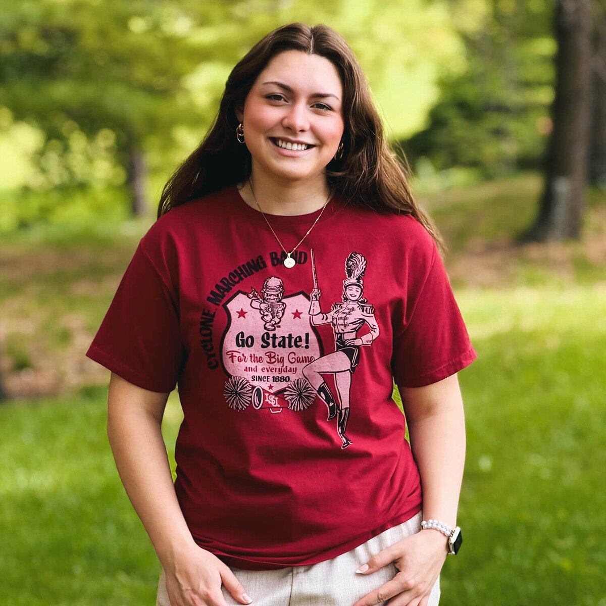 A student wearing Comfort Wash Marching Band Cy Cardinal Short Sleeve T-Shirt